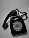 A vintage and antique telephone with white background.